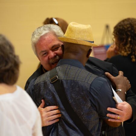 a person hugging another person