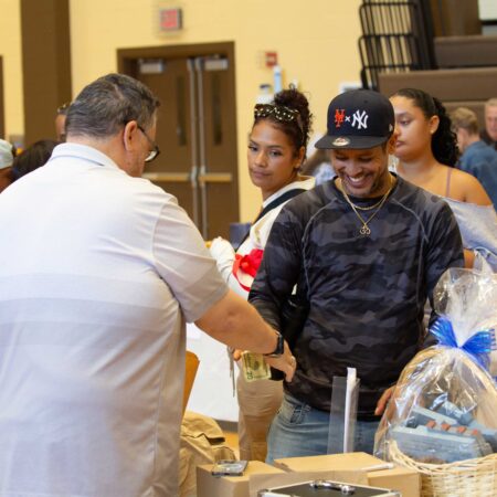 a person handing a bag of food to a person