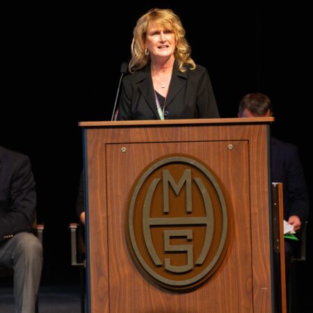 a person standing at a podium