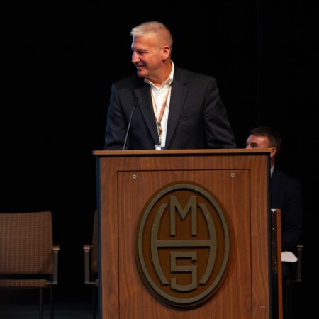 a person standing at a podium