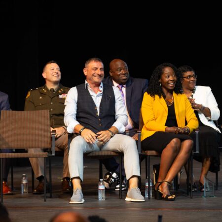 a group of people sitting on chairs
