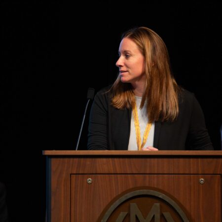 a person standing at a podium