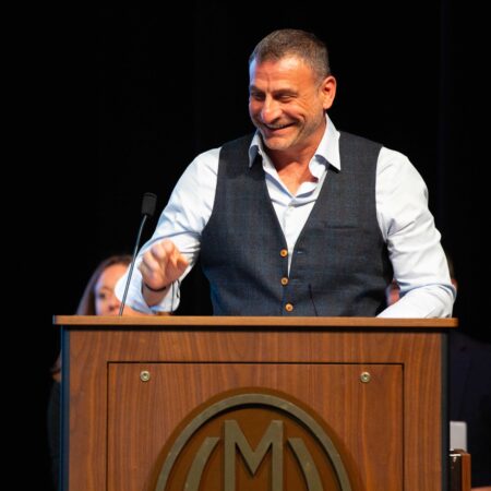 a person standing at a podium