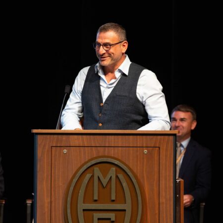 a person standing at a podium