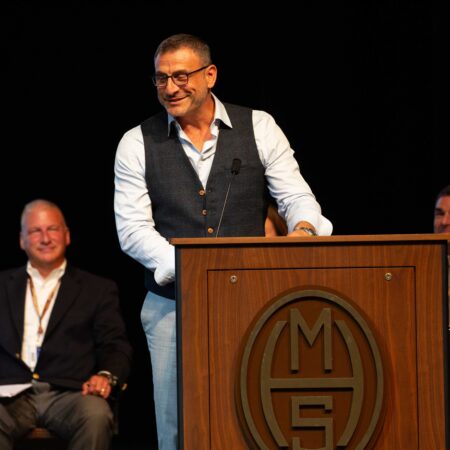 a person standing at a podium