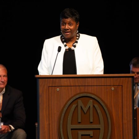 a person standing at a podium