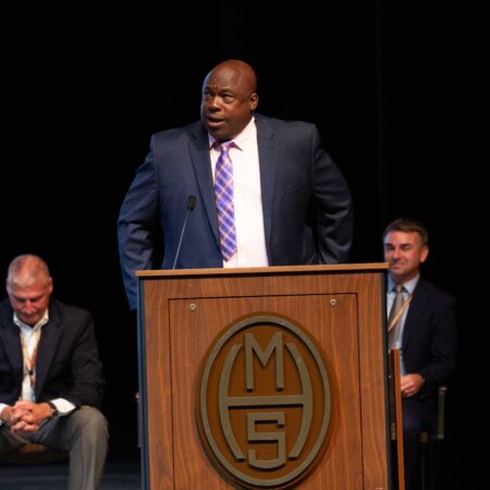 a person standing at a podium