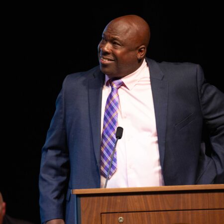 a person standing at a podium