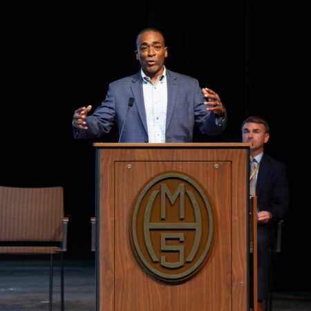 a person standing at a podium