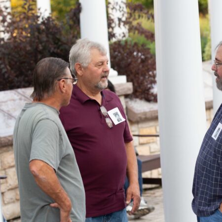 a group of men standing outside