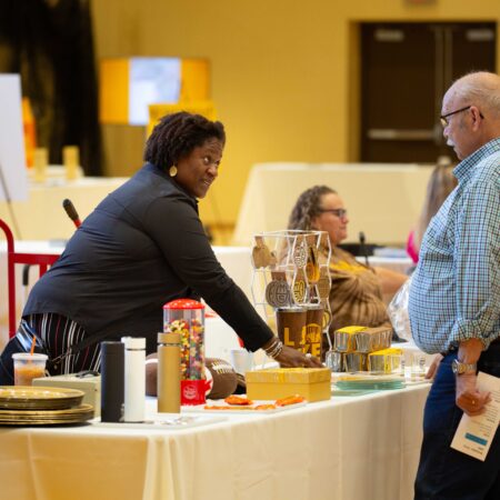 a person serving food at a table