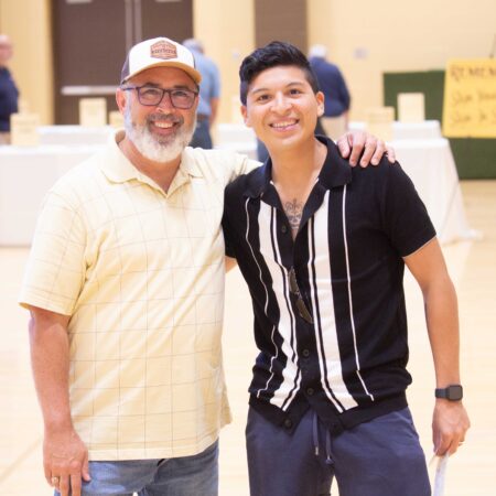 a person and a young person standing together