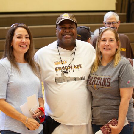 a person with two women standing next to each other