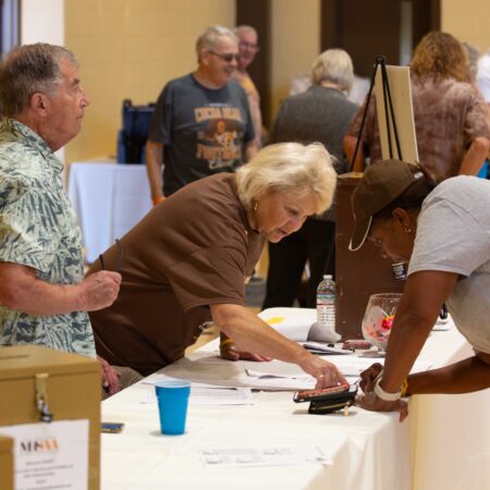a person taking a receipt from a table