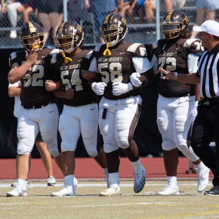 a group of football players on a field