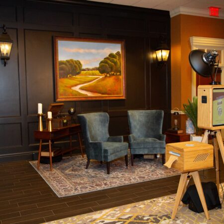 a room with a painting and a table