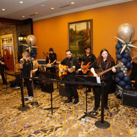 a group of people playing instruments