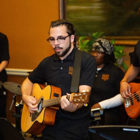 a person playing a guitar