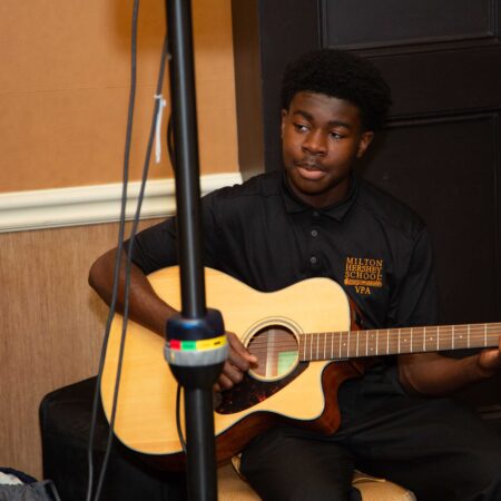 a person playing a guitar