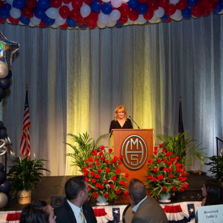 a person standing at a podium