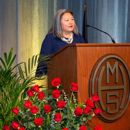 a person standing at a podium