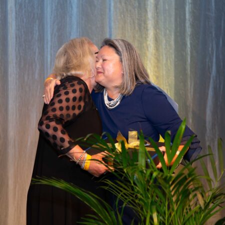 two women kissing each other