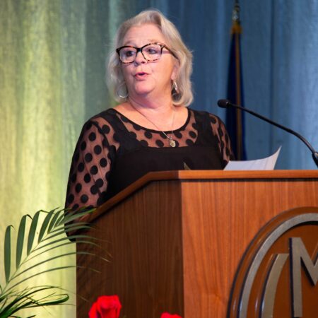 a person standing at a podium