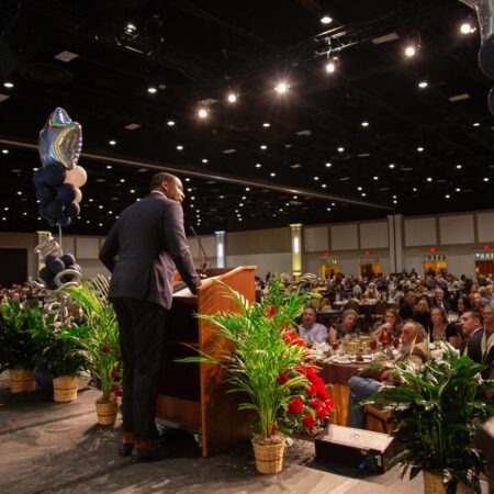 a person standing at a podium