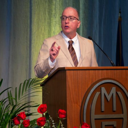 a person standing at a podium