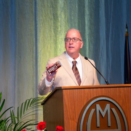 a person standing at a podium