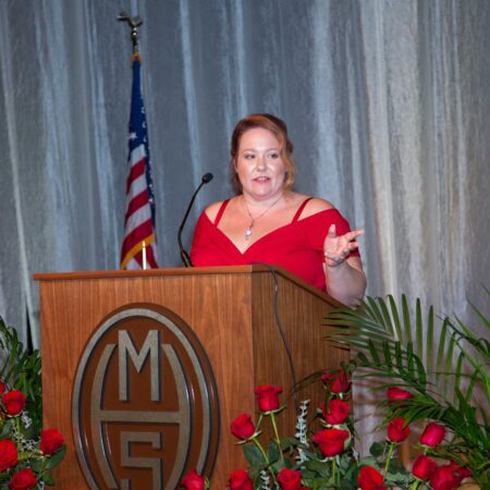 a person standing at a podium
