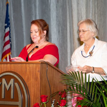 a person standing at a podium