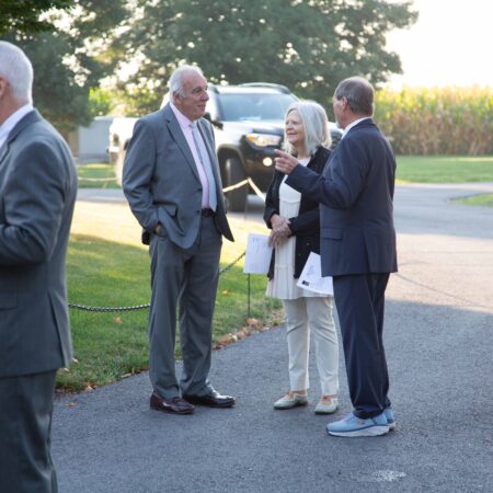 a group of people standing on a road