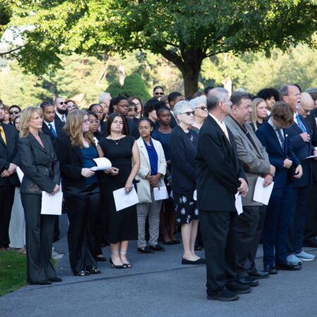 a group of people standing in a line