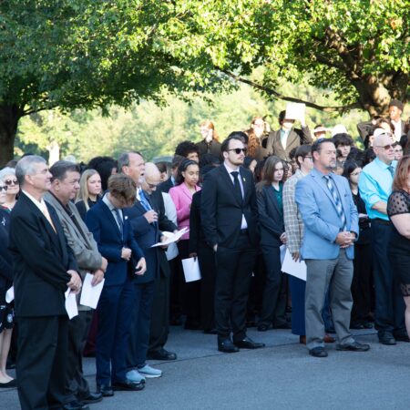 a group of people standing in a line