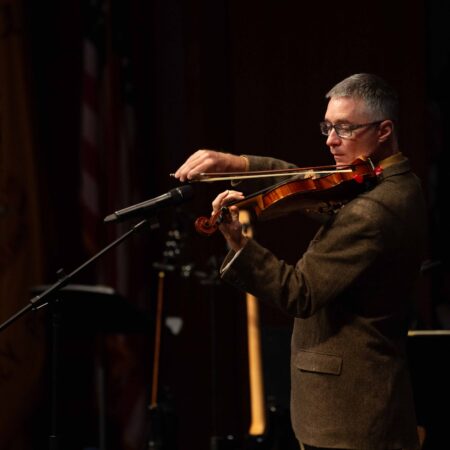 a person playing a violin