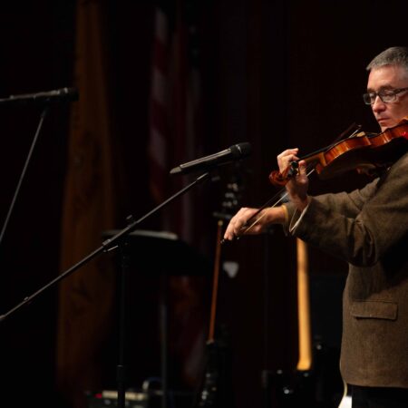 a person playing a violin