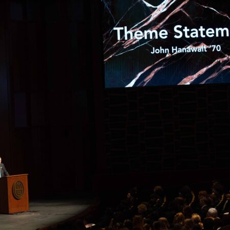 a person standing at a podium