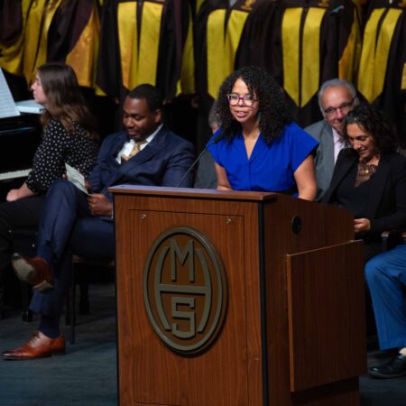 a person standing at a podium