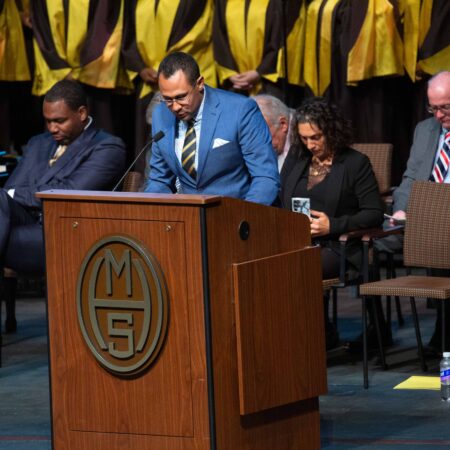 a person standing at a podium