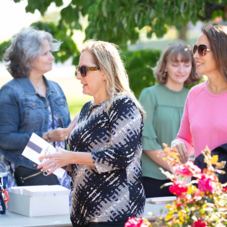 a group of women standing outside