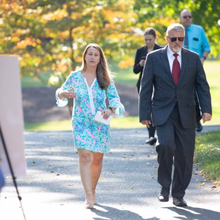 a person walking on a sidewalk