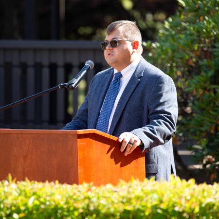 a person standing at a podium