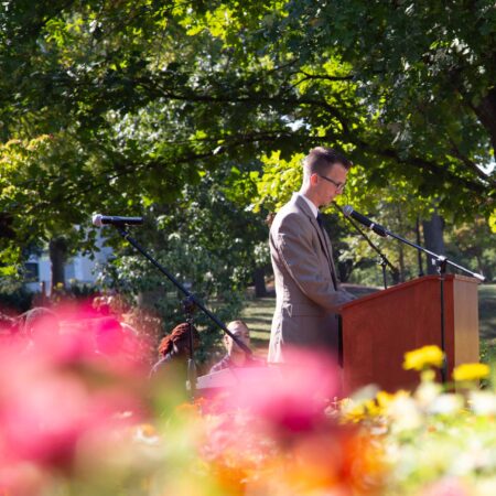 a person standing at a podium