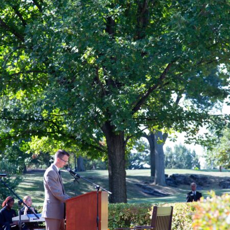 a person standing at a podium