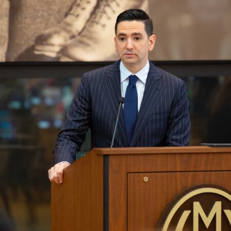 a person standing at a podium