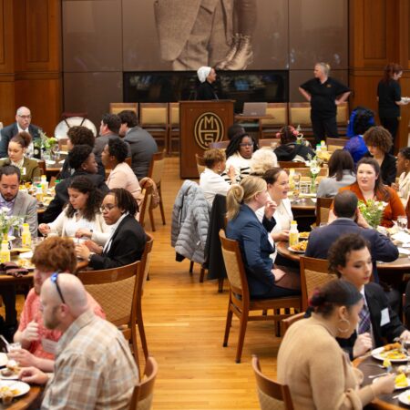a group of people sitting at tables