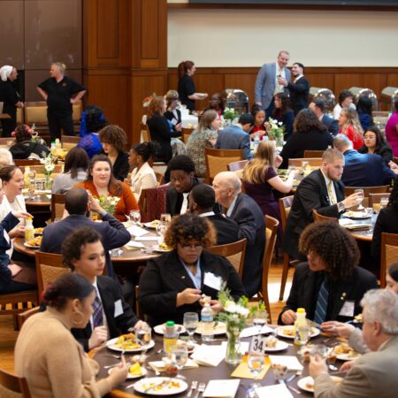a group of people sitting at tables