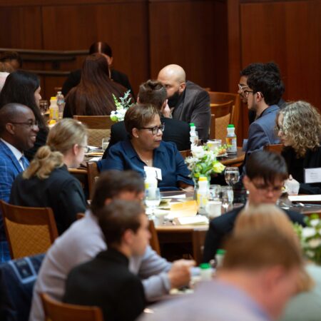a group of people sitting at tables