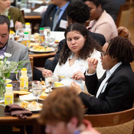 a group of people sitting at tables